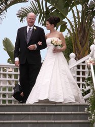 Lillian and her dad coming down the stairs/aisle