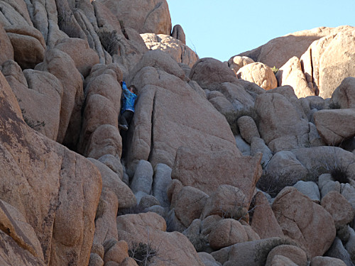 Caleb climbing a crevase 