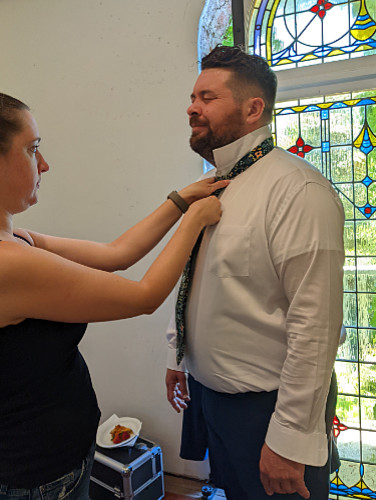 Andy getting his tie tied