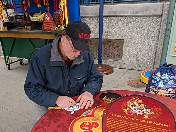 Craig coloring a Lunar New Year fan