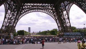 crowd beneath the Eiffel Tower