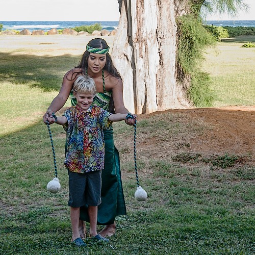 Caleb learning to twirl at Luau