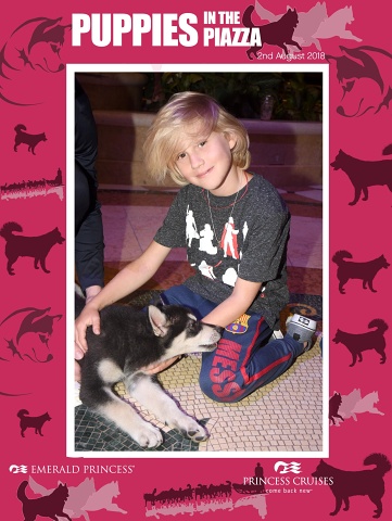 Caleb with sled dog puppy