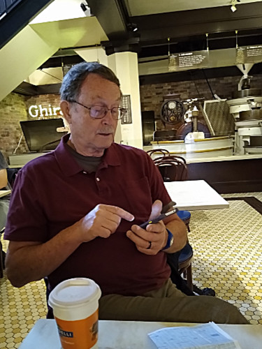 Craig checking messages in Ghirardelli store