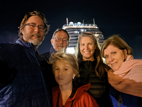 family photo in front of Majestic Princess stern